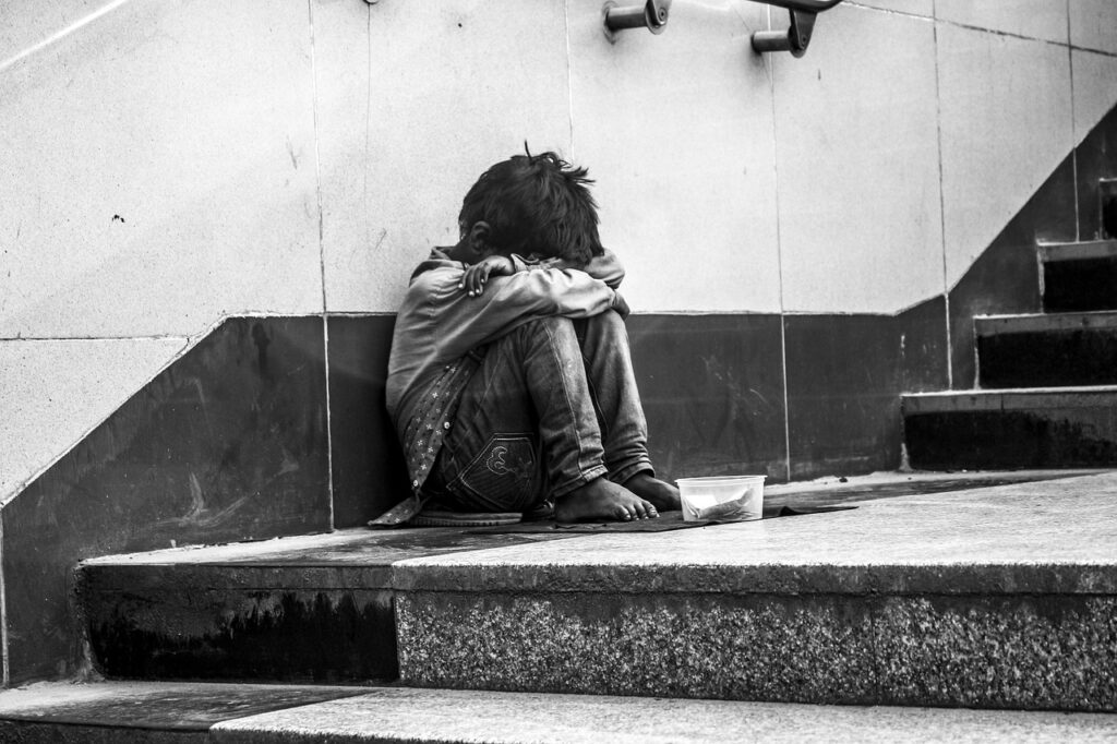 Homeless boy on steps