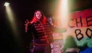 Drag king Frank Opinion performs onstage at queer nightclub Cheery Bomb